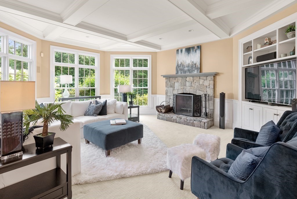 66 Goodnow Road Sudbury, MA 01776 - Photo 16 of 42 a living room with furniture and a fireplace