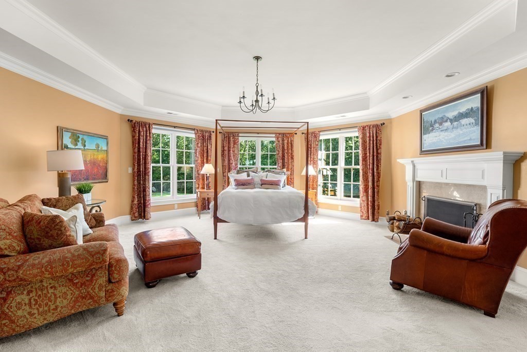 66 Goodnow Road Sudbury, MA 01776 - Photo 20 of 42 a living room with furniture and a fireplace