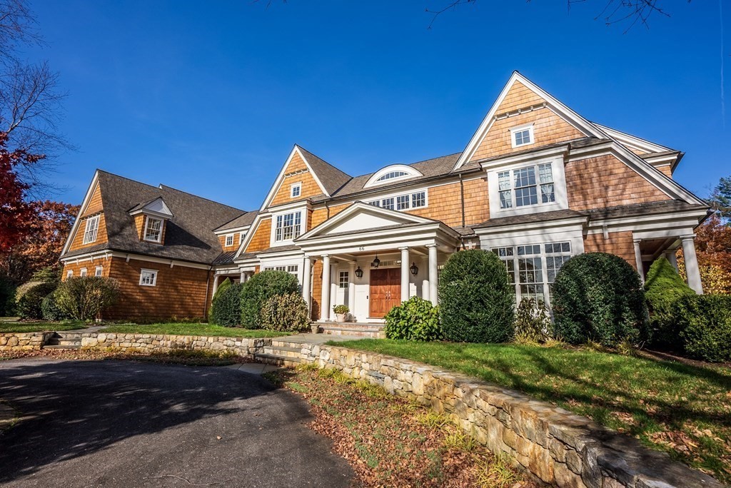66 Goodnow Road Sudbury, MA 01776 - Photo 2 of 42 a front view of a house with a garden