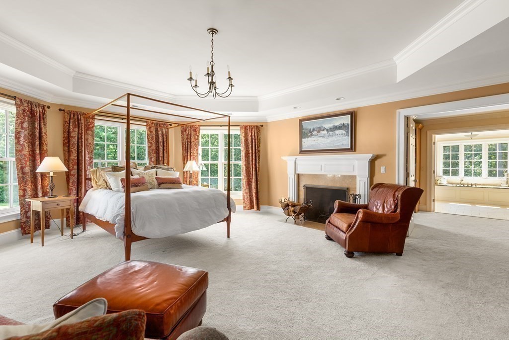 66 Goodnow Road Sudbury, MA 01776 - Photo 21 of 42 a living room with furniture and a fireplace