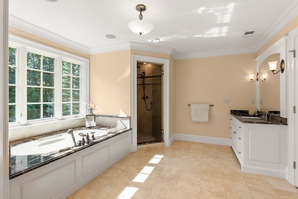 66 Goodnow Road Sudbury, MA 01776 - Photo 22 of 42 a large kitchen with granite countertop a sink and a stove top oven