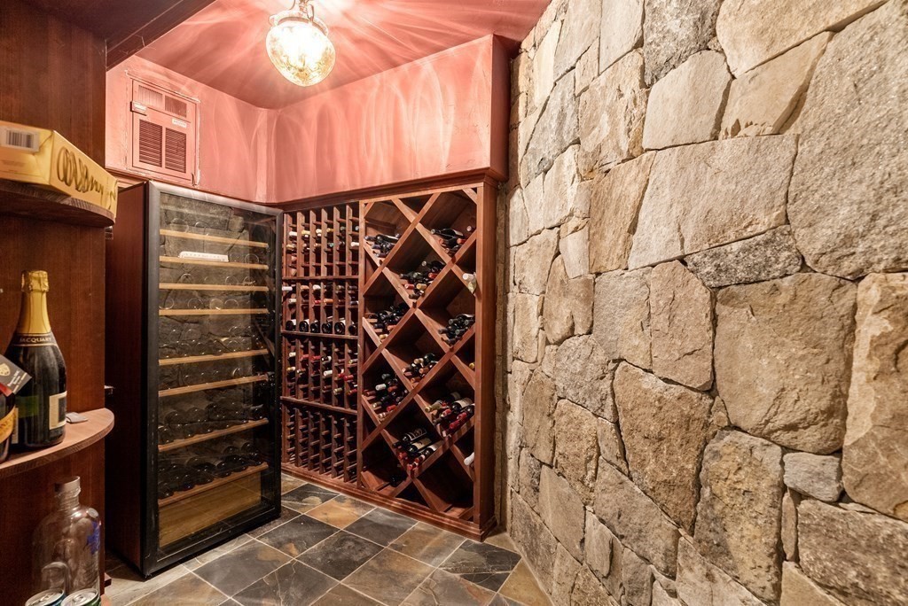 66 Goodnow Road Sudbury, MA 01776 - Photo 28 of 42 a view of walk in closet with clothes and shoes