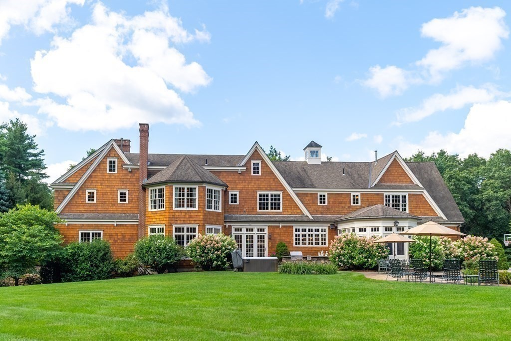 66 Goodnow Road Sudbury, MA 01776 - Photo 3 of 42 a front view of a house with a yard