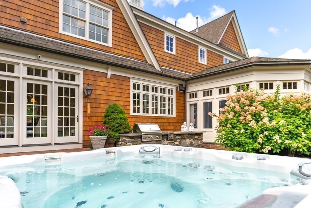 66 Goodnow Road Sudbury, MA 01776 - Photo 33 of 42 a front view of a house with a yard