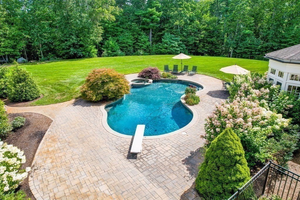 66 Goodnow Road Sudbury, MA 01776 - Photo 35 of 42 a view of a swimming pool with a yard