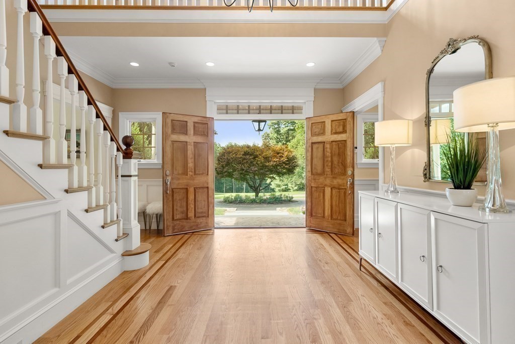 66 Goodnow Road Sudbury, MA 01776 - Photo 4 of 42 a view of a living room with a large window and wooden floor