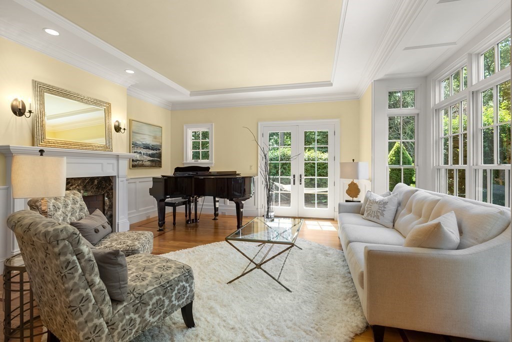 66 Goodnow Road Sudbury, MA 01776 - Photo 6 of 42 a living room with furniture and a fireplace
