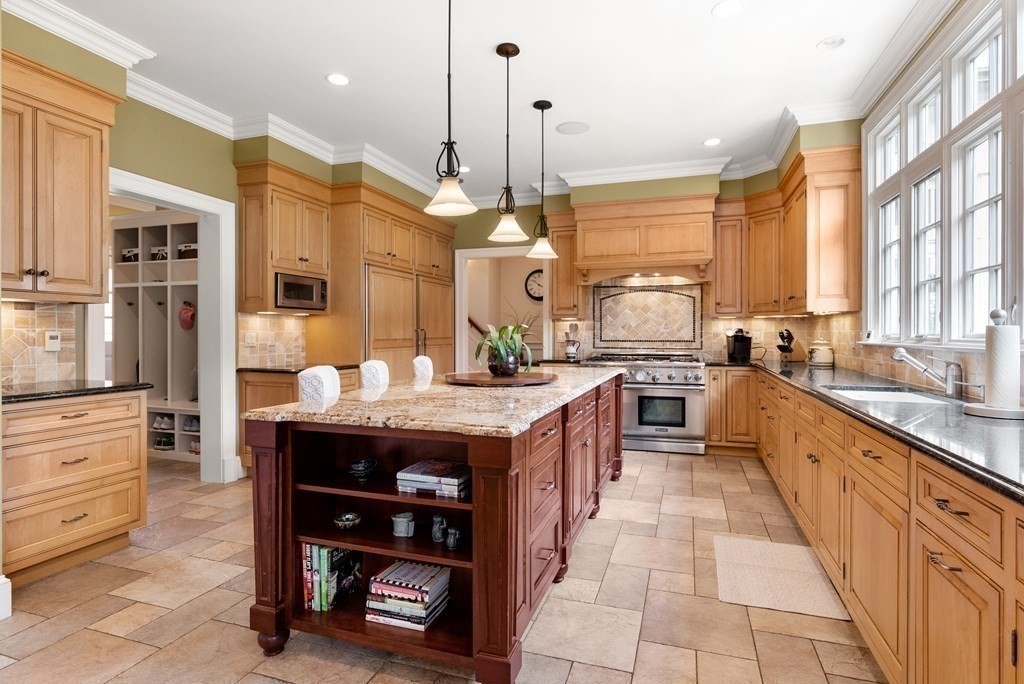 66 Goodnow Road Sudbury, MA 01776 - Photo 9 of 42 a large kitchen with stainless steel appliances granite countertop a stove a sink and a refrigerator