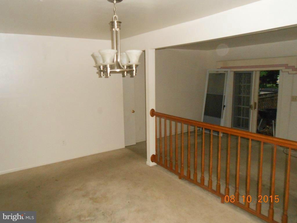 4807 Variation Road Baltimore, MD 21236 - Photo 3 of 13 a view of a hallway with chandelier