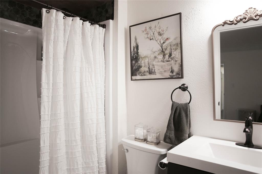 1720 Crystal Way Plano, TX 75074 - Photo 18 of 32 a bathroom with a shower and a sink