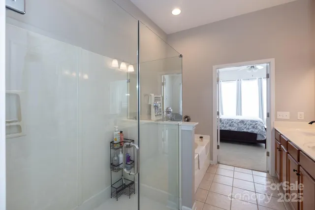 a bathroom with a tub sink and a mirror