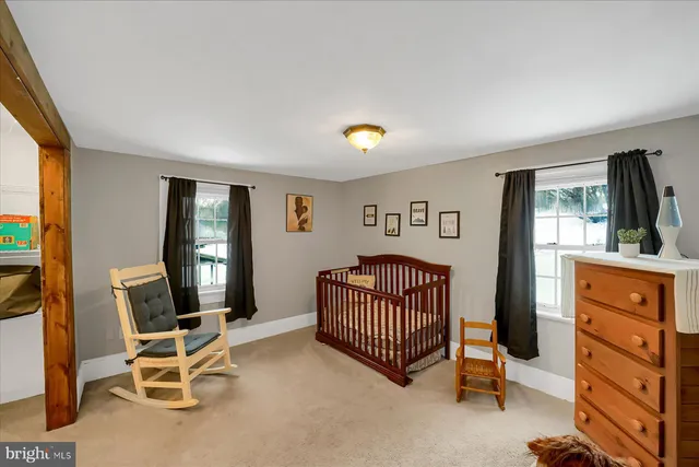 a bedroom with furniture and a window