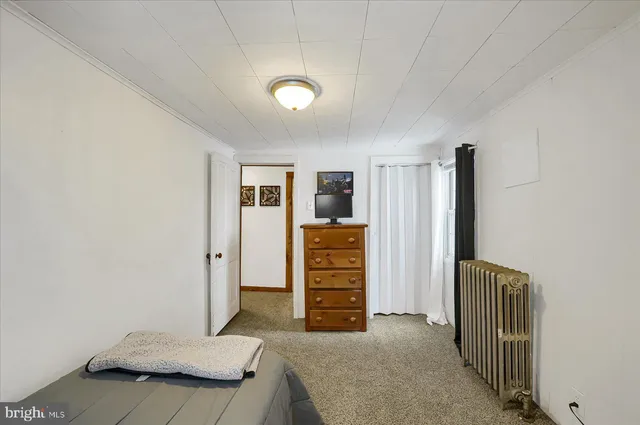 a view of room with furniture and closet