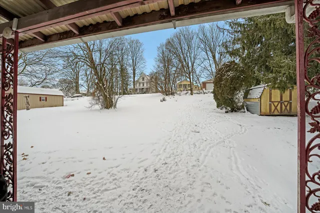 a view of snow on the road