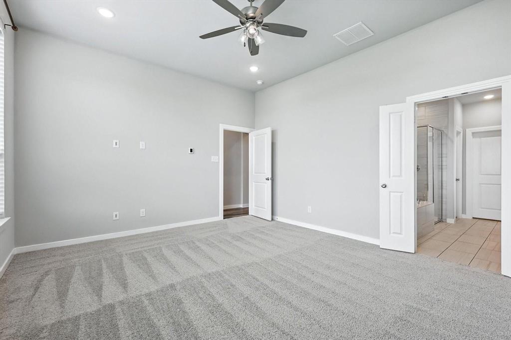 4203 Parrot Lane Sherman, TX 75092 - Photo 17 of 38 wooden floor in an empty room with a ceiling fan