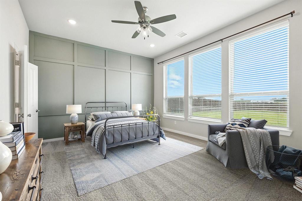 4203 Parrot Lane Sherman, TX 75092 - Photo 18 of 38 a bed room with a bed and a chair