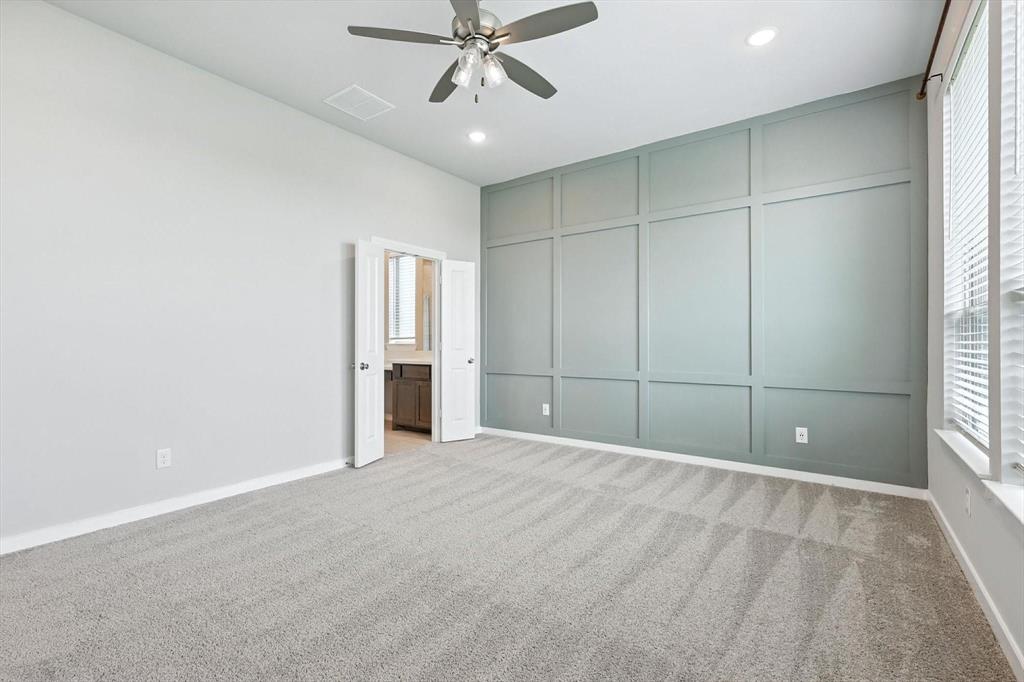 4203 Parrot Lane Sherman, TX 75092 - Photo 20 of 38 an empty room with fan and windows