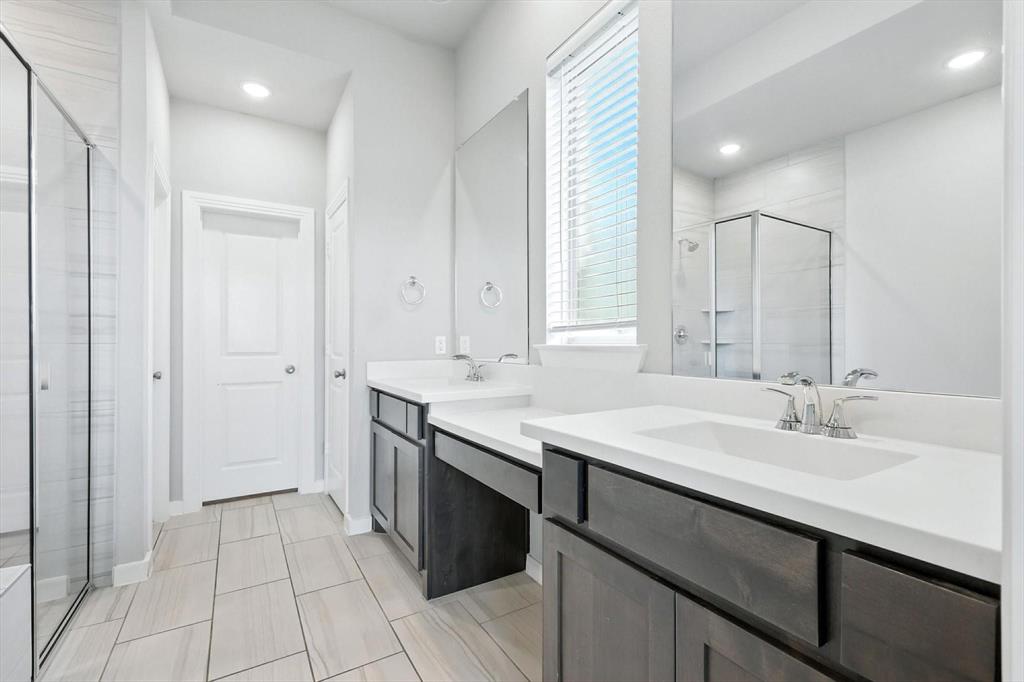 4203 Parrot Lane Sherman, TX 75092 - Photo 21 of 38 a bathroom with a sink double vanity and a mirror