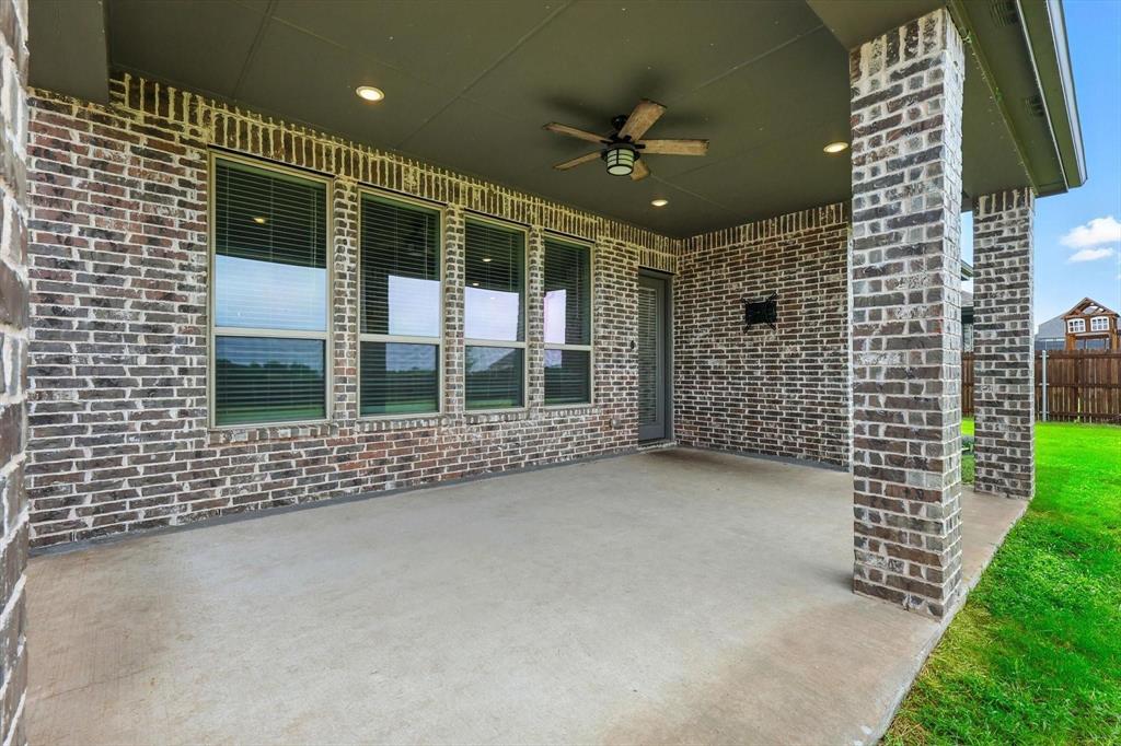 4203 Parrot Lane Sherman, TX 75092 - Photo 36 of 38 a view of a porch with a table and chairs