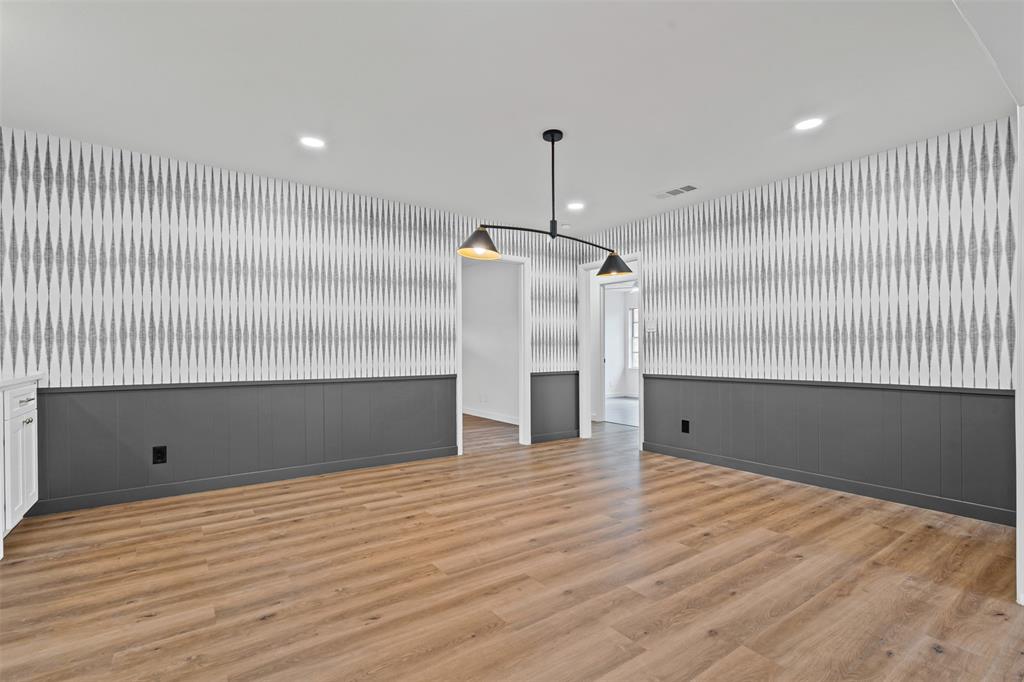 4920 Rector Avenue Fort Worth, TX 76133 - Photo 13 of 37 a view of an empty room with wooden floor