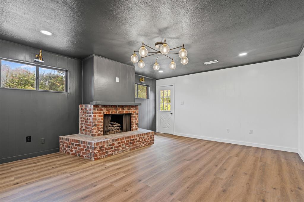 4920 Rector Avenue Fort Worth, TX 76133 - Photo 17 of 37 wooden floor in an empty room with a window