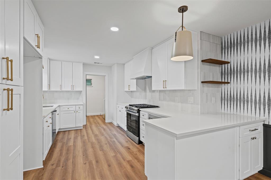 4920 Rector Avenue Fort Worth, TX 76133 - Photo 20 of 37 a kitchen with granite countertop white cabinets and stainless steel appliances