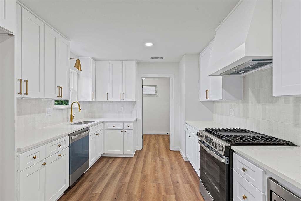 4920 Rector Avenue Fort Worth, TX 76133 - Photo 21 of 37 a kitchen with granite countertop cabinets stainless steel appliances and a counter space