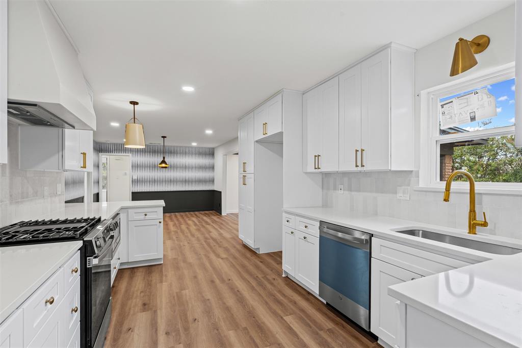 4920 Rector Avenue Fort Worth, TX 76133 - Photo 23 of 37 a kitchen with stainless steel appliances sink refrigerator and stove