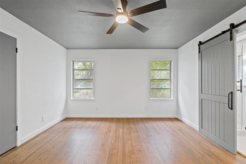 4920 Rector Avenue Fort Worth, TX 76133 - Photo 32 of 37 wooden floor in an empty room with a window