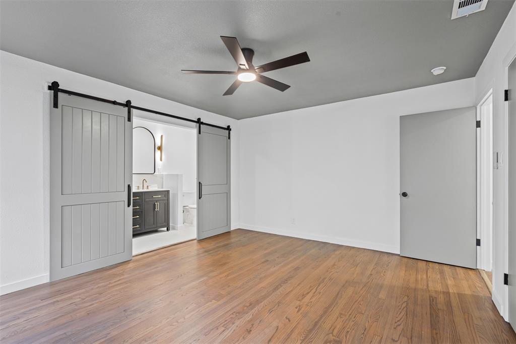 4920 Rector Avenue Fort Worth, TX 76133 - Photo 33 of 37 a view of empty room with wooden floor and fan