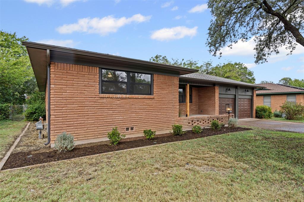 4920 Rector Avenue Fort Worth, TX 76133 - Photo 4 of 37 a front view of a house with a yard