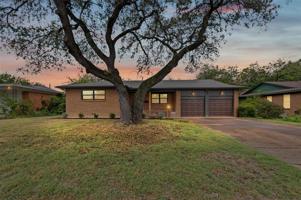 4920 Rector Avenue Fort Worth, TX 76133 - Photo 5 of 37 a front view of a house with a yard and garage