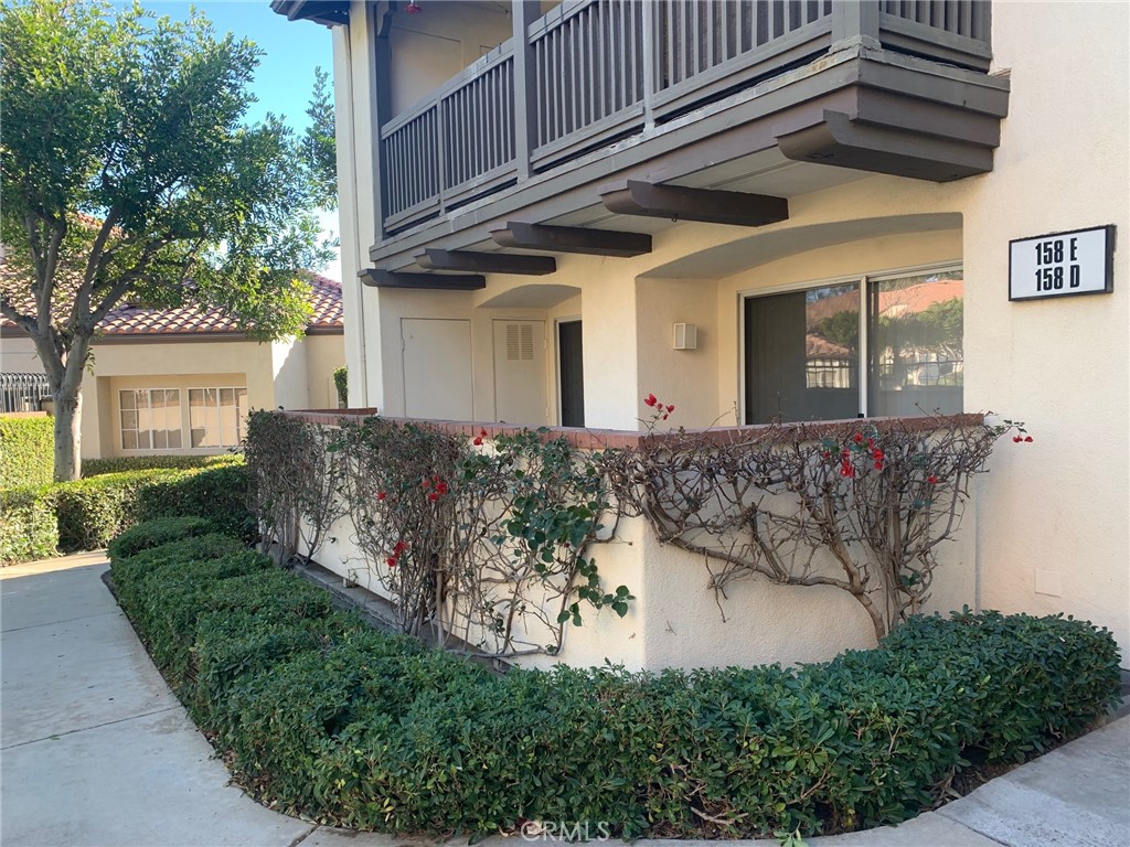 158 South Cross Creek Road, Unit D Orange, CA 92869 - Photo 2 of 7 a front view of a house with garden