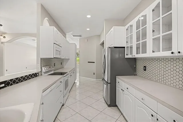 a kitchen with cabinets and window