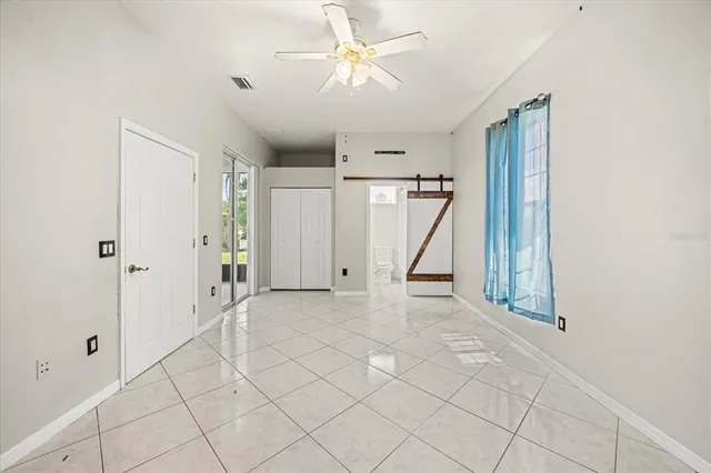a white toilet sitting next to a bath tub