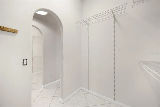 a kitchen with a cabinets and chandelier