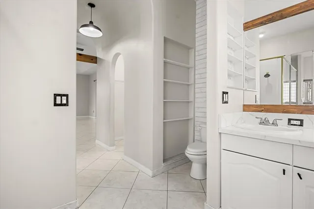 a view of porch with a floor to ceiling window and tree