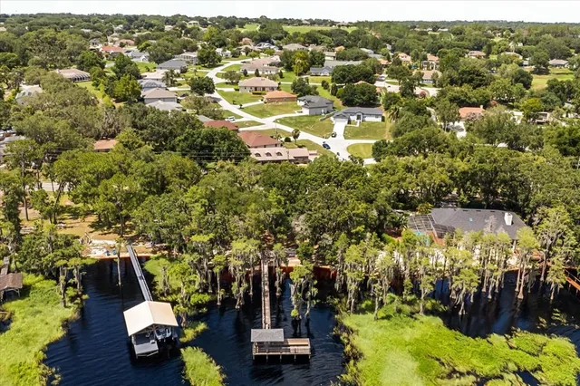 an aerial view of residential houses with outdoor space