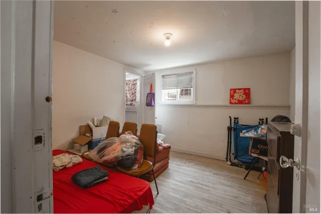 a bedroom with furniture and pillows