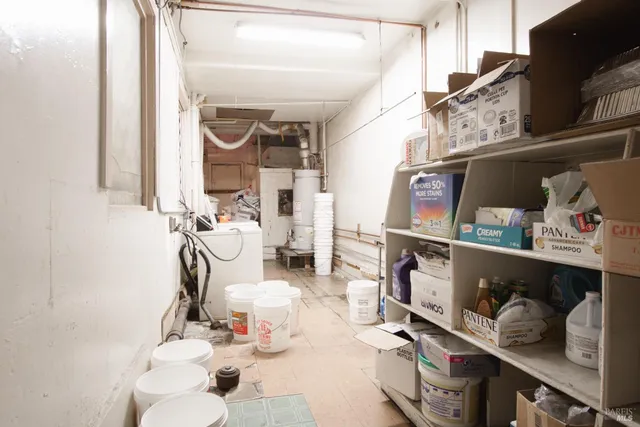 a bathroom with a toilet tub and a sink