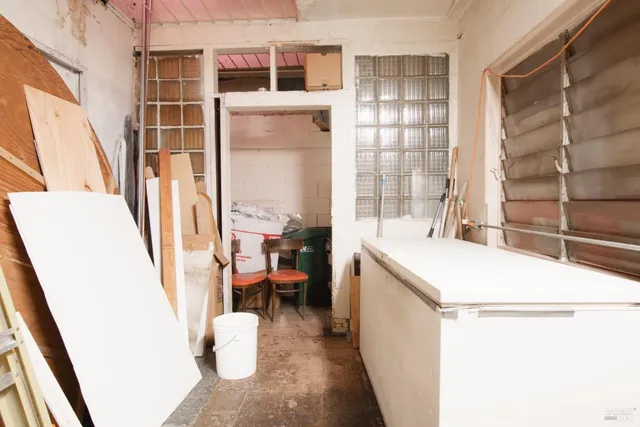 a living room with lots of furniture and a chandelier