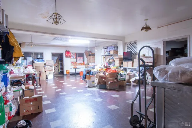 a view of kitchen with furniture and large window