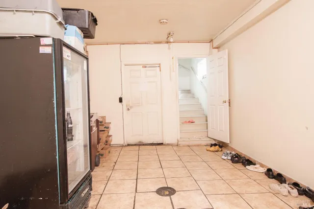 a swimming pool with large glass windows and painted walls