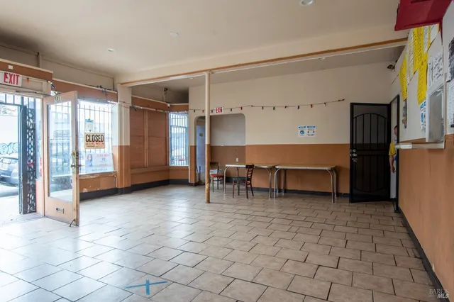 a view of a building with retail shops