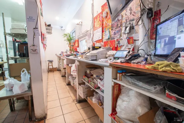a view of staircase with white walls and white door