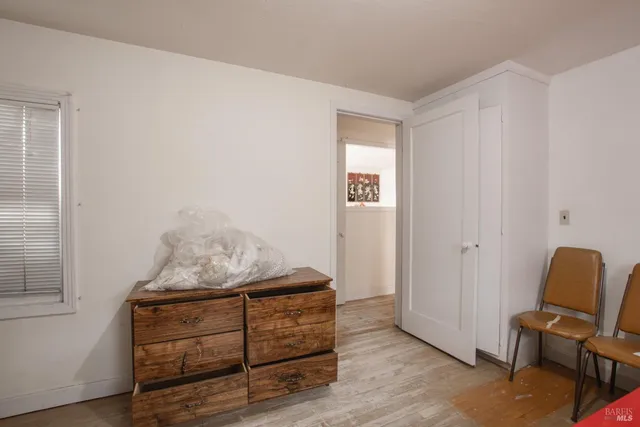 a view of backyard with wheel chair potted plants and outdoor seating