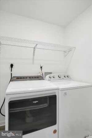 a close view of laundry room with a stove