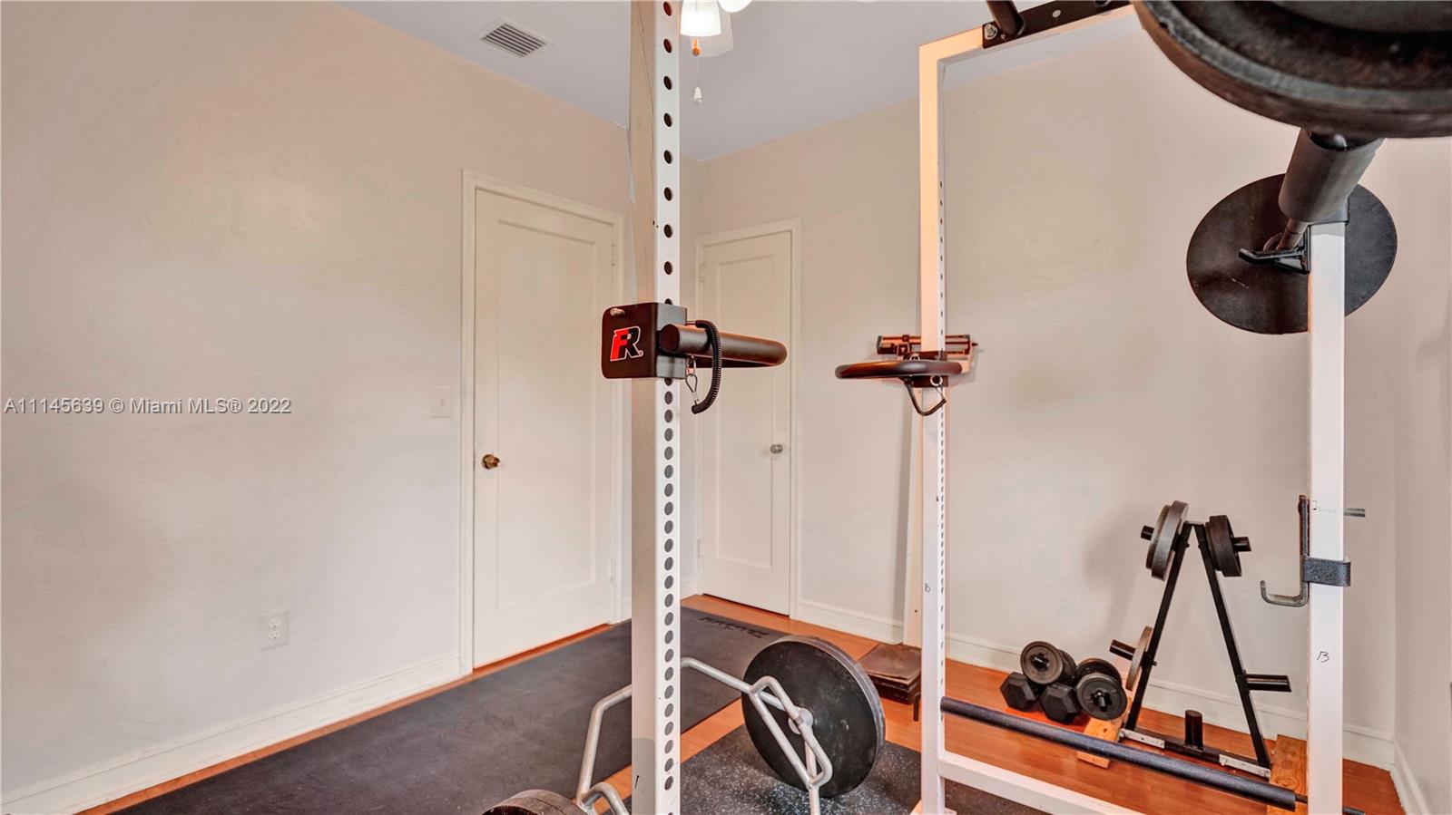 152 Northwest 103rd Street Miami Shores, FL 33150 - Photo 18 of 27 a view of a room with gym equipment