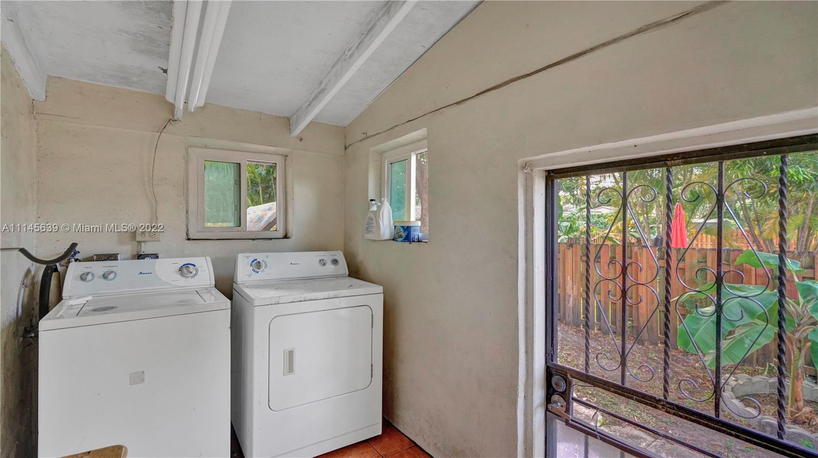 152 Northwest 103rd Street Miami Shores, FL 33150 - Photo 27 of 27 a utility room with dryer and washer