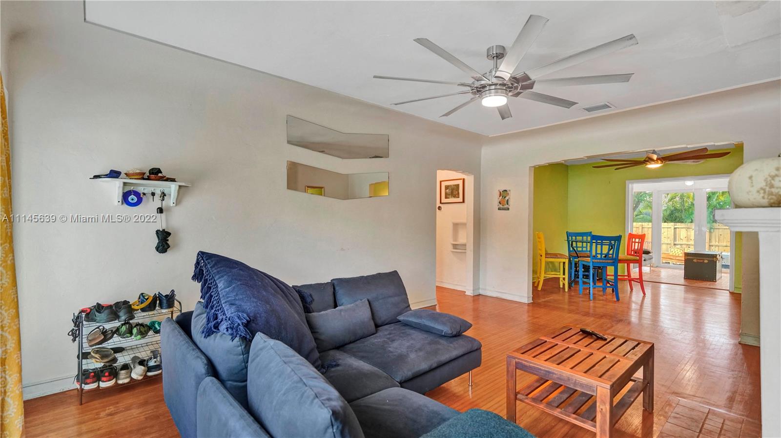 152 Northwest 103rd Street Miami Shores, FL 33150 - Photo 10 of 27 a living room with furniture and wooden floor